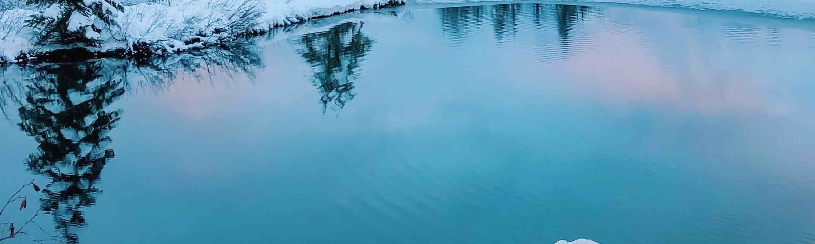 Beautiful Christmas winter sunset at Gold Creek Pond. In the wintertime you have to park on the side of the road, almost right off the highway and snowshoe (you might not need the snowshoes is the snow is packed enough) to the trailhead.