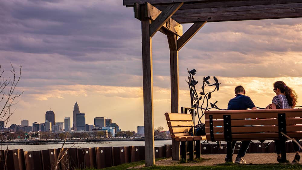 Couple on bench at sunset