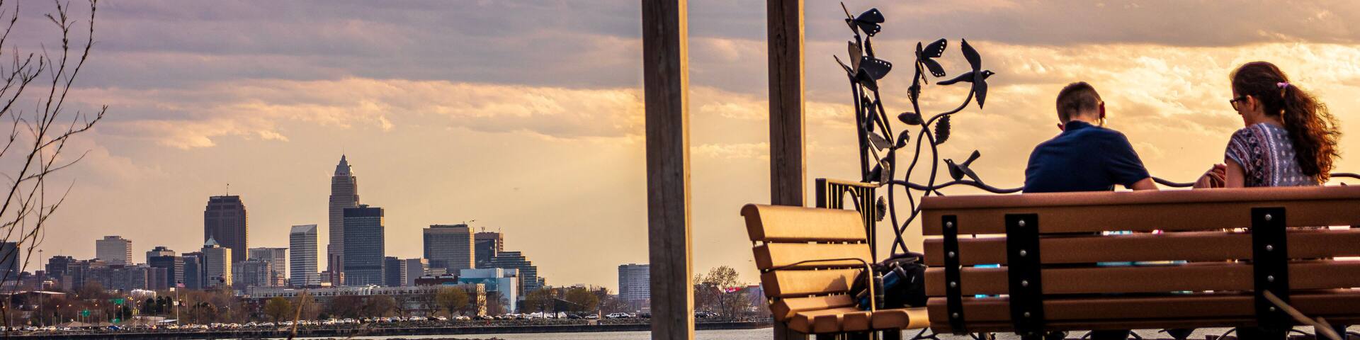 Couple on bench at sunset