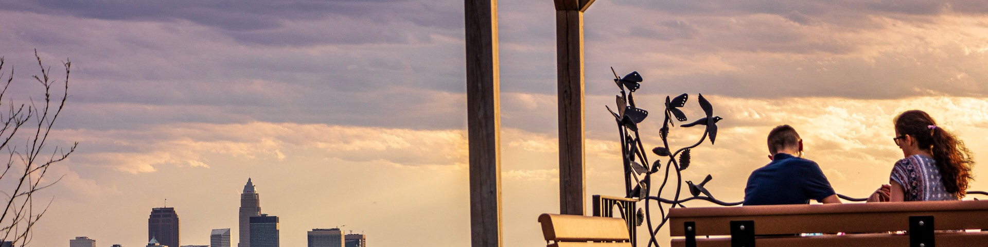 Couple on bench at sunset
