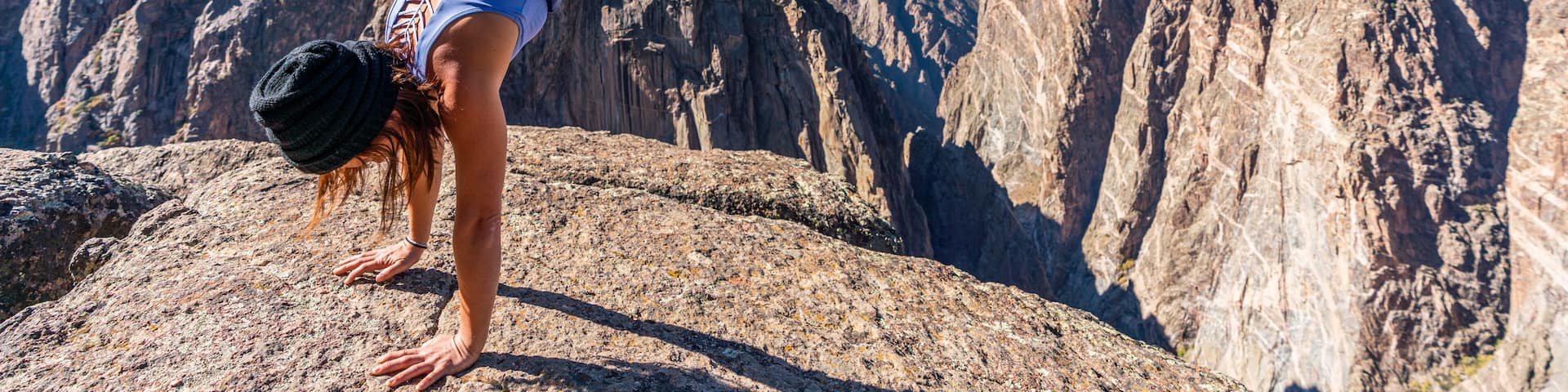 Woman Doing Handstands and Looking over the Black Canyon of the Gunnison