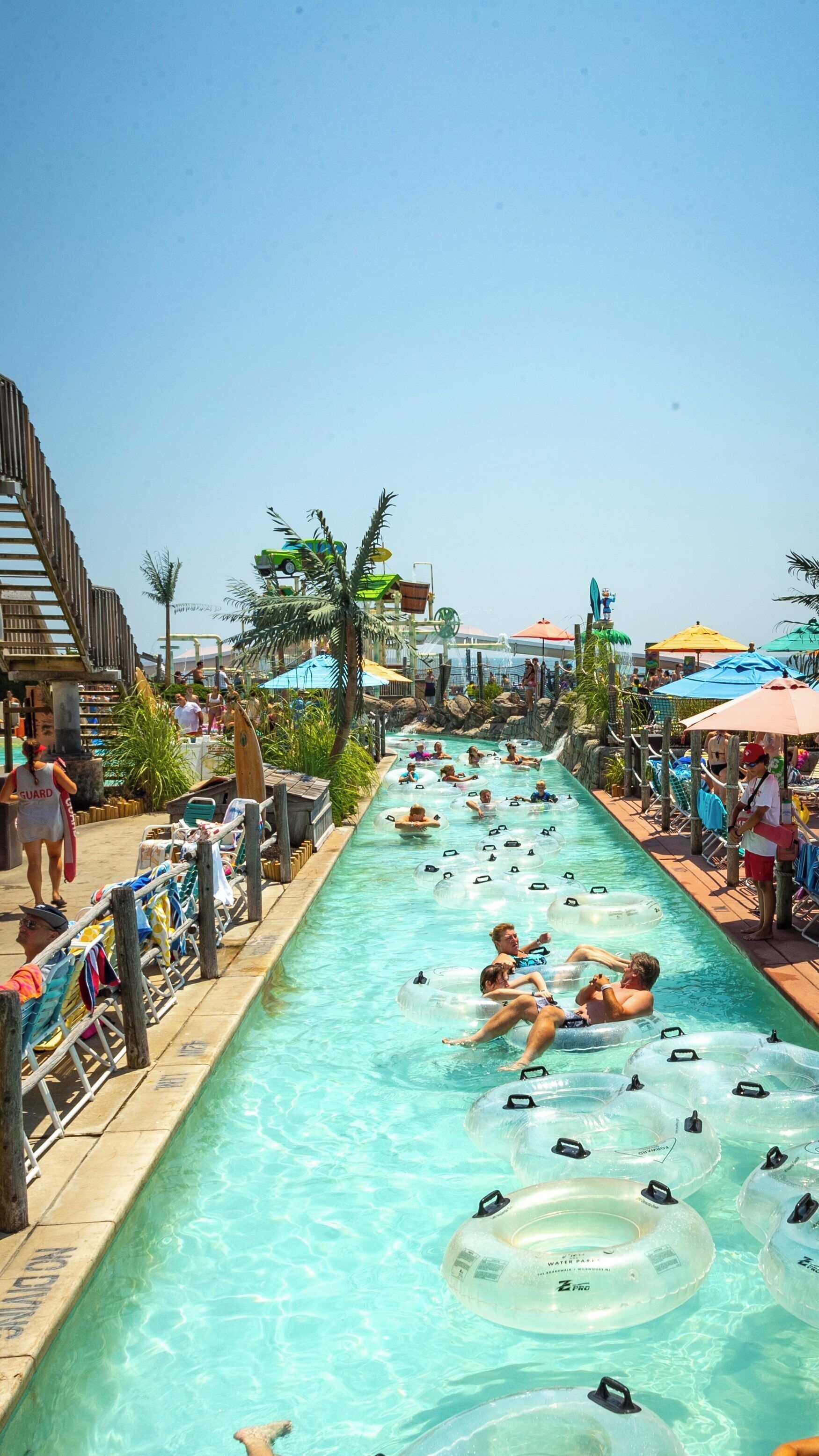 Enjoying a summer day at Ocean Oasis Waterpark and Beach Club in Wildwood, New Jersey with lazy river floats and beach umbrellas