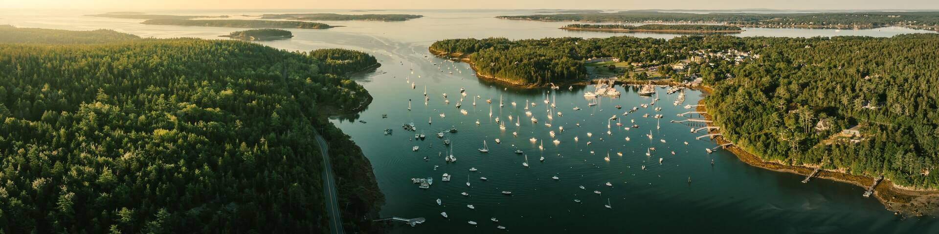 Panoramic drone shot of sunrise in Northeast Harbor, Main near Bar Harbor on Mount Desert Island