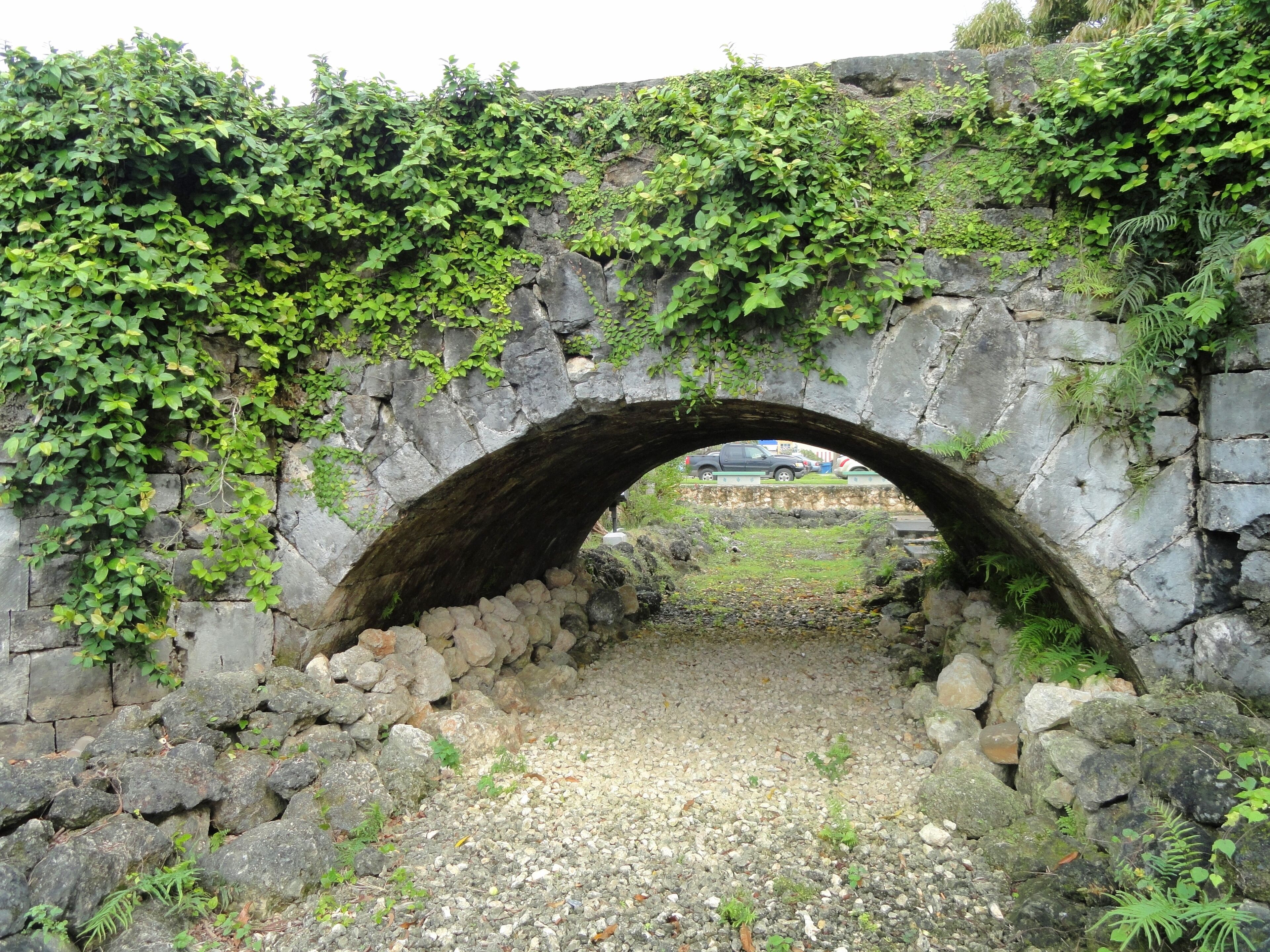 San Antonio Bridge (Old Spanish Bridge, To'lai Acho) in Hagåtña, Guam, USA. This bridge was built in 1800 and now on the National Register of Historic Places.