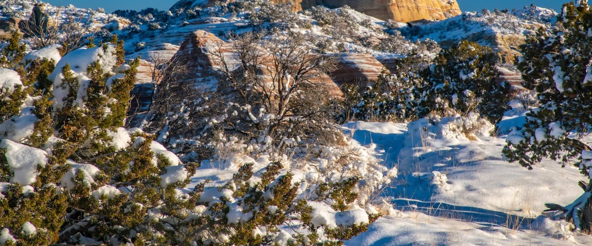USA, New Mexico, Gallup, Red Rock Park. Church Rock in winter sunrise.