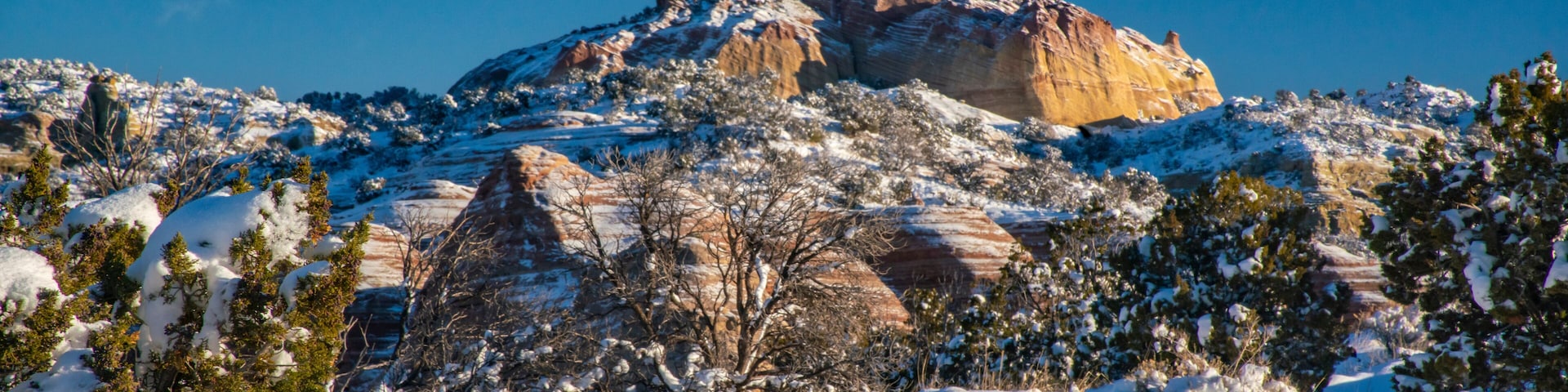 USA, New Mexico, Gallup, Red Rock Park. Church Rock in winter sunrise.