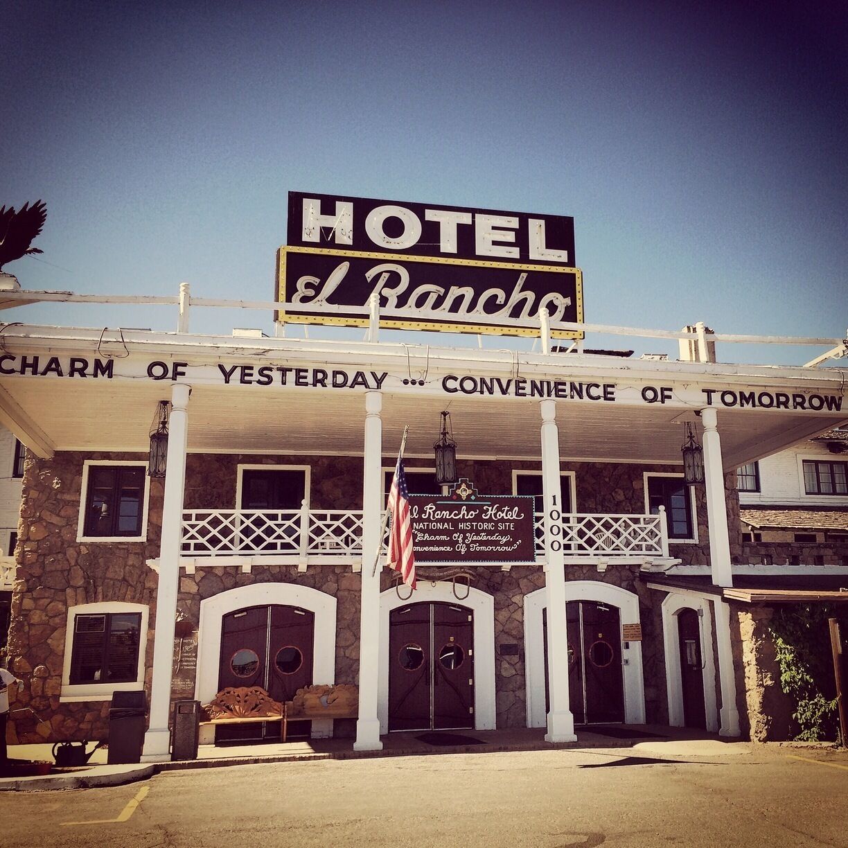 A historic hotel with a prominent sign reading "HOTEL El Rancho."
