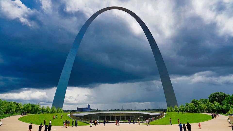 The Gateway Arch with a cloudy sky in the background.