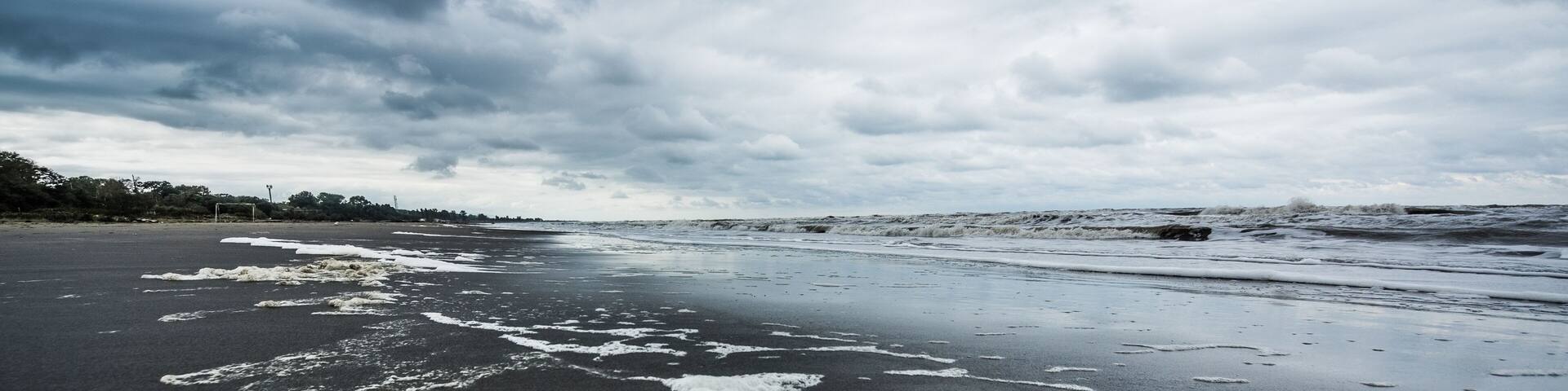 Caspian sea under blue sky in early September, snag on the beach