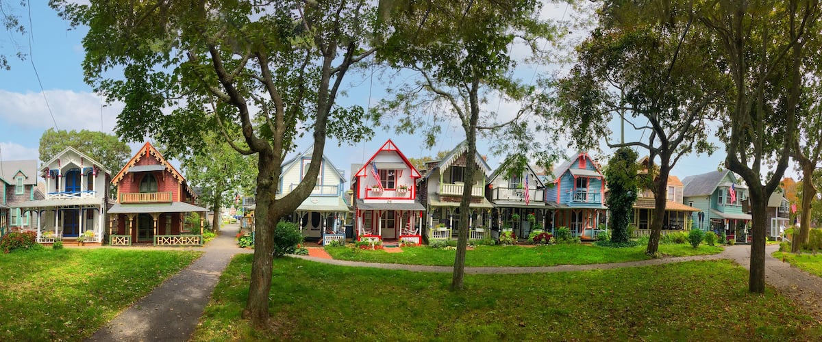 A row of colorful, historic houses with a central path.