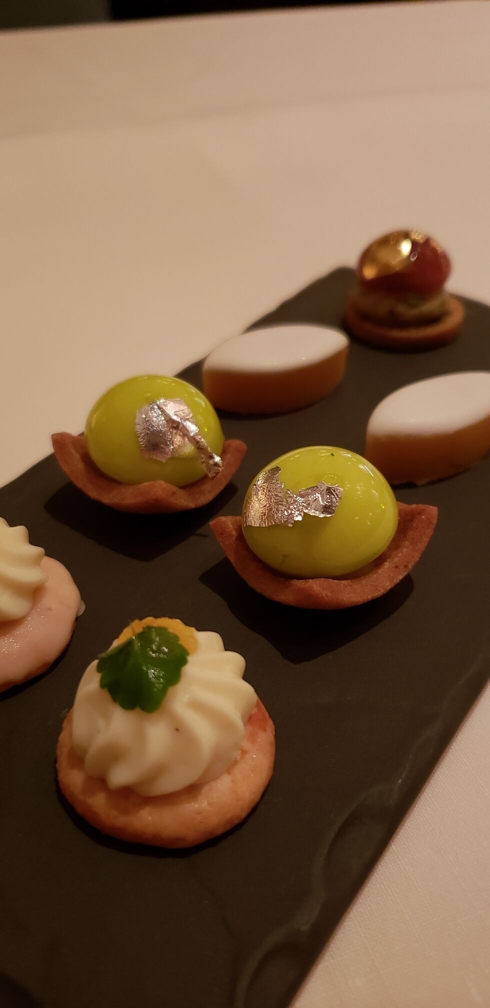 The swiss put gold on everything! Petit fours at Il Lago in Geneva #LifeAtExpedia #sweet