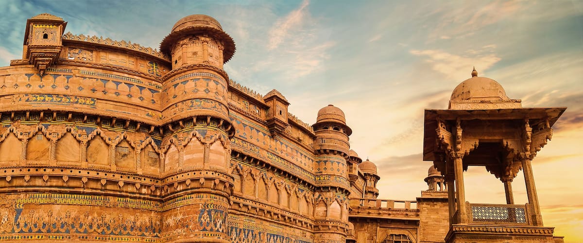A historic building with intricate carvings and domes.