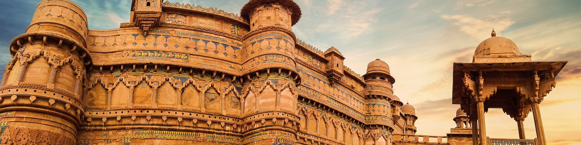 A historic building with intricate carvings and domes.