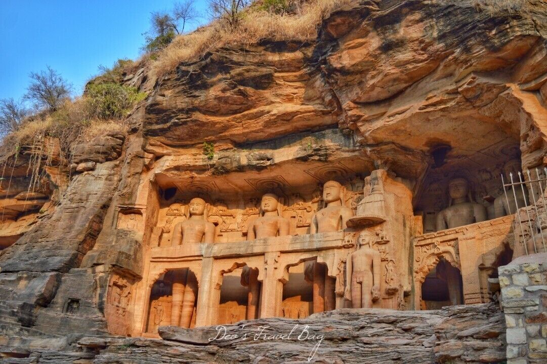 t was around 3.30 AM when my tuk tuk driver stopped the auto all of sudden. I asked him immediately why he stopped it in the mid of the way. .

He replied that I would have to climb from there till the fort becuase of the height. .

I was exhauseted and just wanted to crash in the bed but I had to walk for another half an hour to reach the fort. .

And all of sudden, my eyes caught something. I felt like something was standing at the distance. Yeah, I was actually a bit scared but I kept walking and soon some amazing pieces of rock sculptures were waiting for me. .

I was stunned to see these stunning sculptures of Jain monks carved so beautifully.
 ------------------------ ----
.
.
.
.
.
.
.
.
#indiaclicks #yourshotphotographer #NGTDailyShot #Natgeotravel #CNtravelerindia #Beautifuldestinations #LonelyPlanetIndia #indiaclicks #theweekoninstagram #indiapictures #storiesofindia 
#IncredibleIndia  #_soi #igramming_india #indiatravel #indiatourism #travelrealindia #Lifewelltravelled #travelbug #traveladdict #travellife #travels #travelgram #instatravel #instatraveling #instapassport #travelblog #travelblogger #passionpassport #ilovetravel
#troveontuesday #troveron #GoldenHour #sunset #Lifeatexpedia 