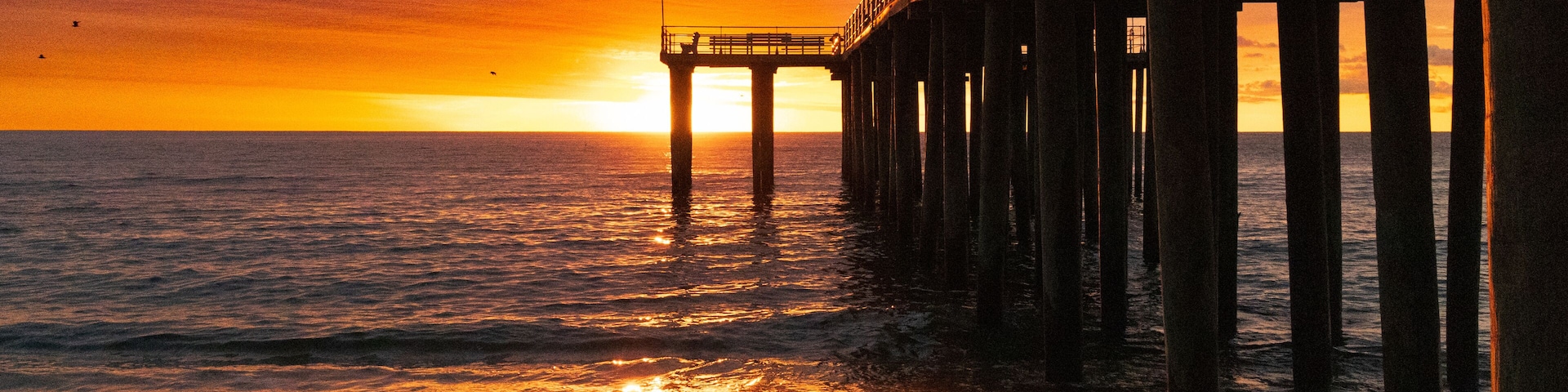 Dramatic sunrise over Ocean Grove pier