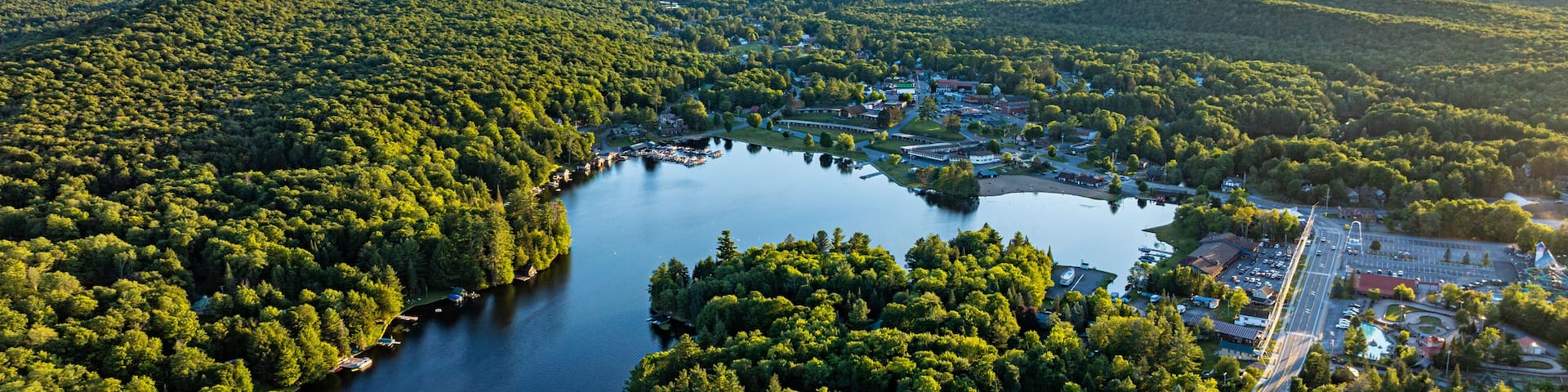 web, new york, usa - july 22, 2025: afternoon aerial summer image of the hamlet of old forge and old forge pond.