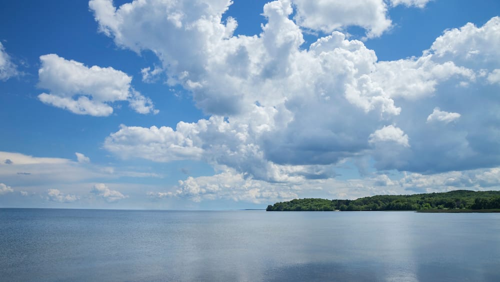 Mille Lacs Lake below dramatic clouds in north central Minnesota on a sunny summer afternoon