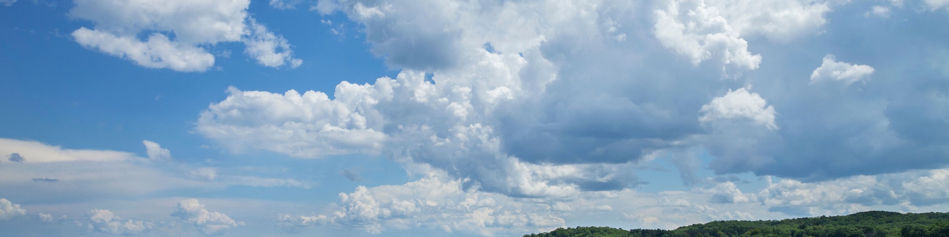 Mille Lacs Lake below dramatic clouds in north central Minnesota on a sunny summer afternoon
