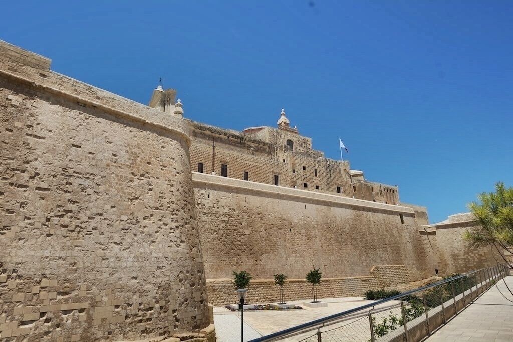 The Cittadella, also known as the Castello, is a citadel in Victoria on the island of Gozo, Malta. The area has been inhabited since the Bronze Age, and the site now occupied by the Cittadella is believed to have been the acropolis of the Punic-Roman city of Gaulos or Glauconis Civitas.