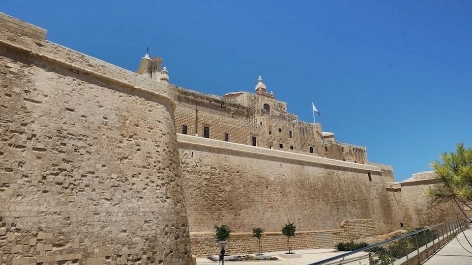 The Cittadella, also known as the Castello, is a citadel in Victoria on the island of Gozo, Malta. The area has been inhabited since the Bronze Age, and the site now occupied by the Cittadella is believed to have been the acropolis of the Punic-Roman city of Gaulos or Glauconis Civitas.