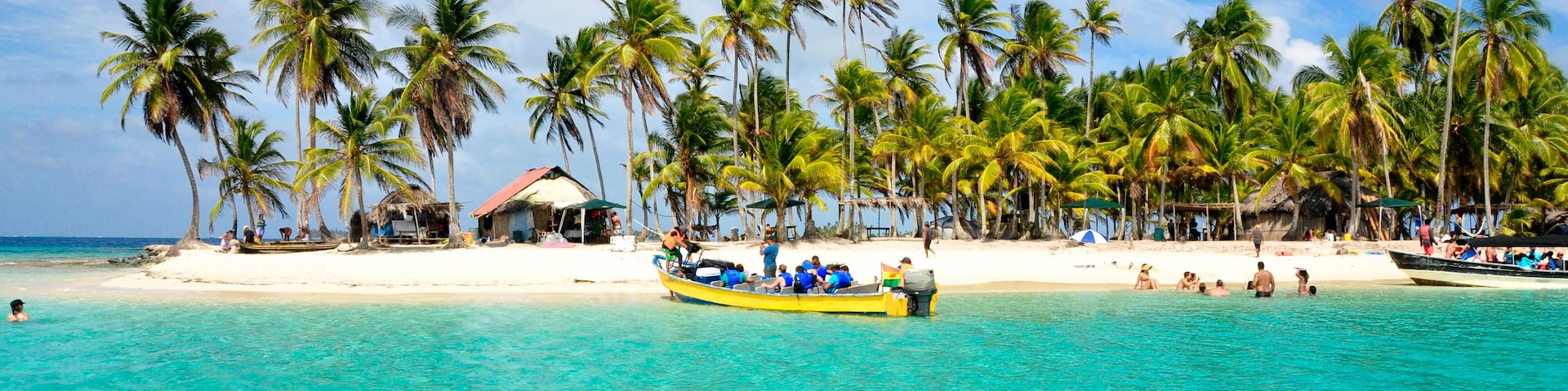 Tourist arriving beautiful beach with crystal clear turquoise water.