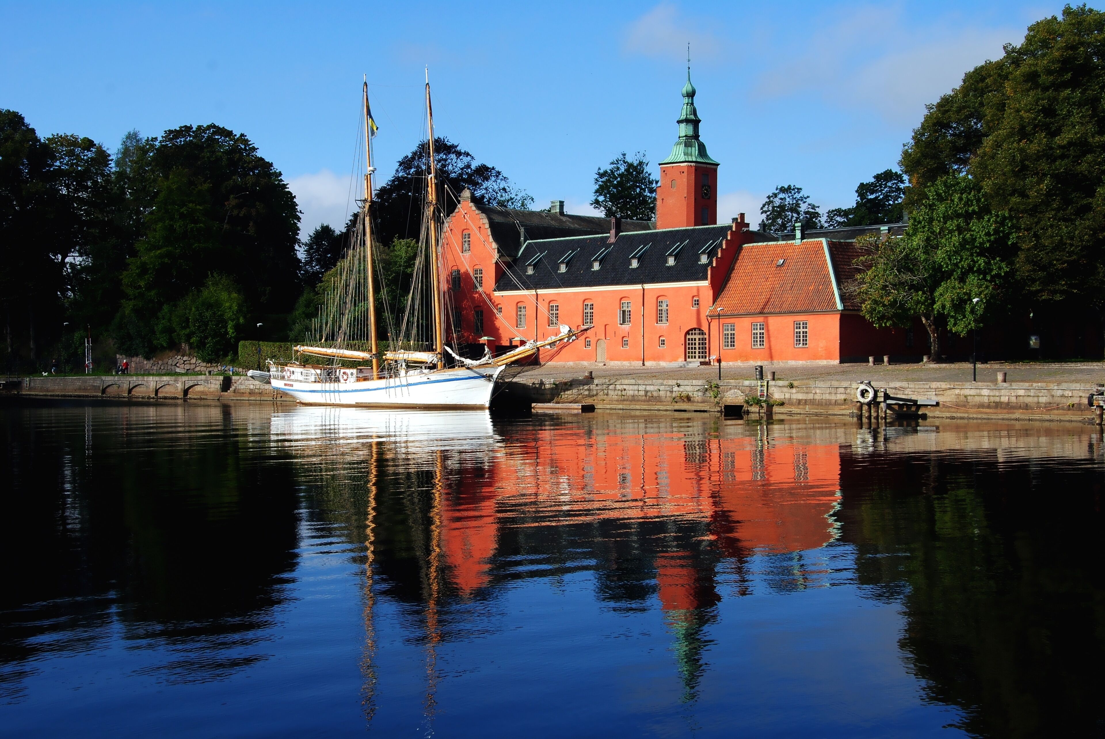 Halmstad Castle (Halmstads slott), a 17th-century castle on the Nissan river in Halmstad, in the province of Halland, Sweden with a two-master moored in front