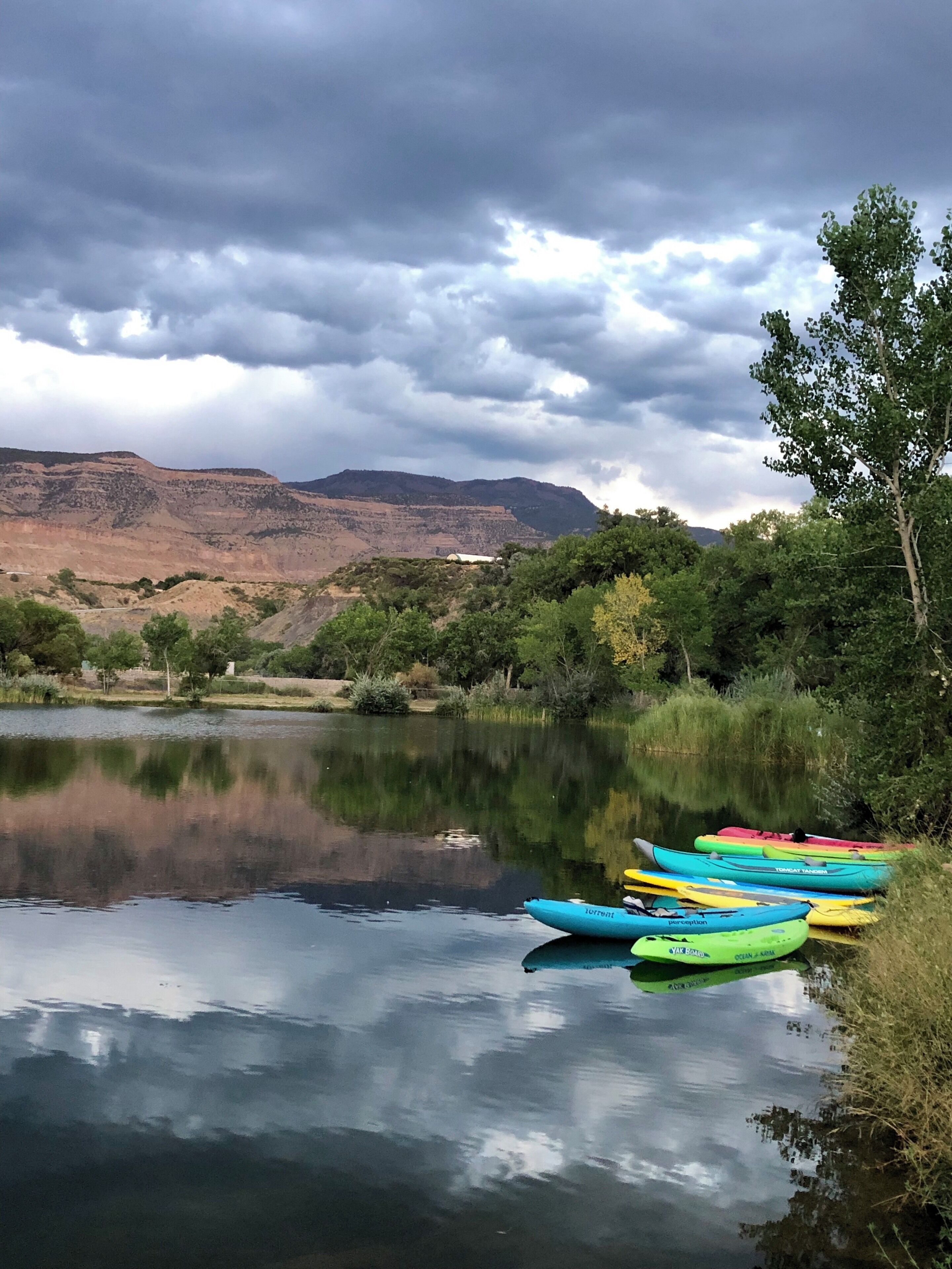 The overcast sky, and the pop of color from the kayaks struck me! #adventure #adventurephotocontest