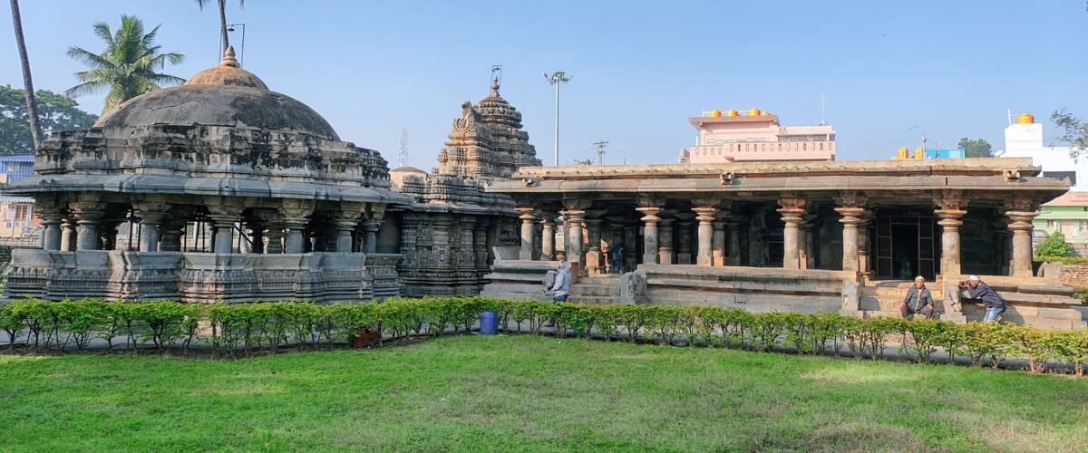 A temple complex with intricate architecture, including a large dome and multiple smaller structures.