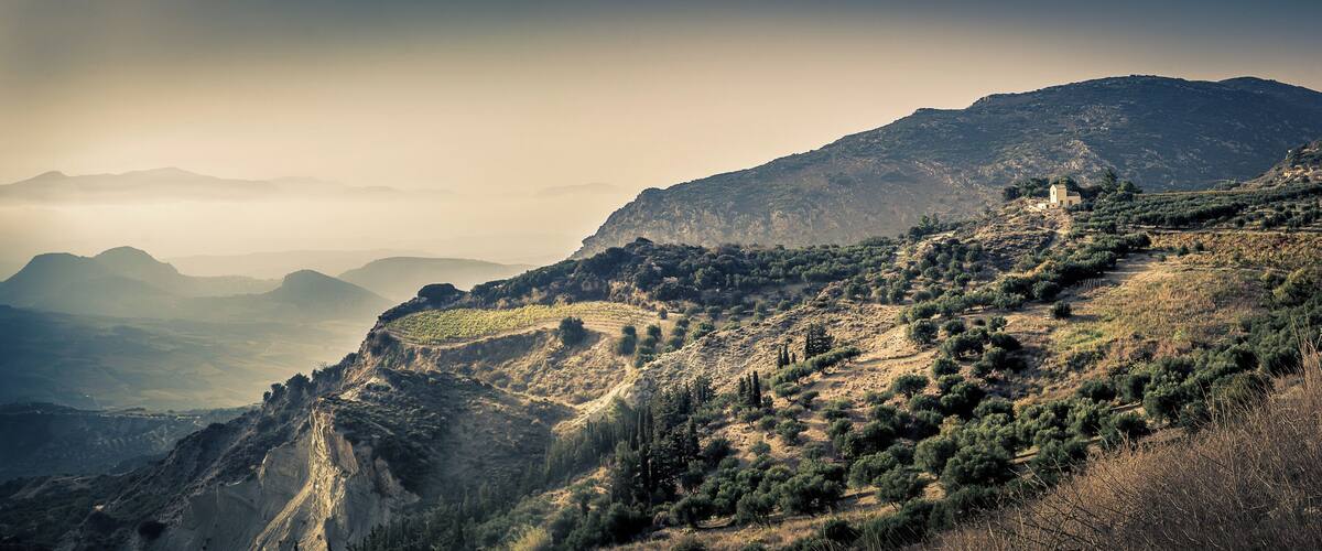Just after the mountain top villages while on the way from Heraklion to Malata I saw this amazing view with what I believe is a farmhouse on the edge of a cliff.. Would likely be even better during sunset.
(I'm not 100% sure exactly where #ontheroad this view is so placed the marker where I think it was)