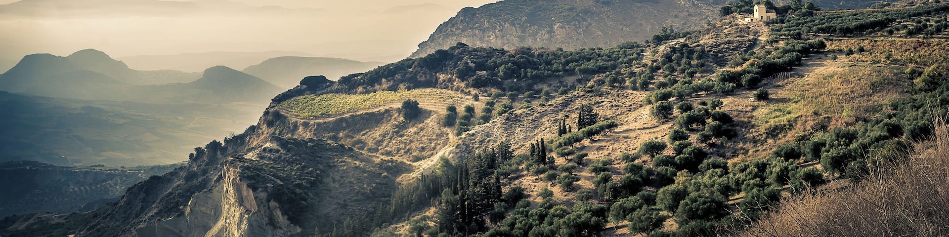 Just after the mountain top villages while on the way from Heraklion to Malata I saw this amazing view with what I believe is a farmhouse on the edge of a cliff.. Would likely be even better during sunset.
(I'm not 100% sure exactly where #ontheroad this view is so placed the marker where I think it was)
