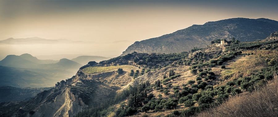 Just after the mountain top villages while on the way from Heraklion to Malata I saw this amazing view with what I believe is a farmhouse on the edge of a cliff.. Would likely be even better during sunset.
(I'm not 100% sure exactly where #ontheroad this view is so placed the marker where I think it was)