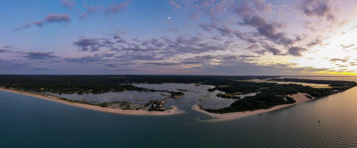 Sunset along the beach at Towd Point in Southampton, Long Island, New York.