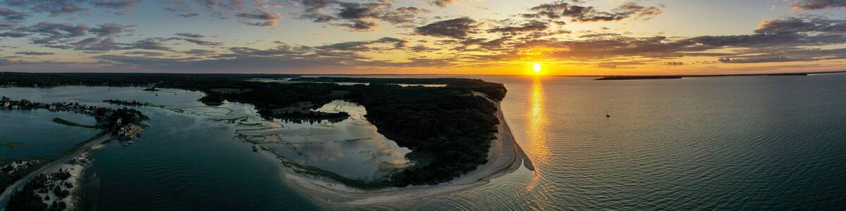 Sunset along the beach at Towd Point in Southampton, Long Island, New York.