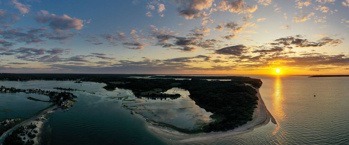 Sunset along the beach at Towd Point in Southampton, Long Island, New York.
