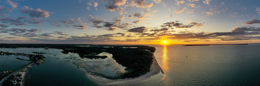 Sunset along the beach at Towd Point in Southampton, Long Island, New York.