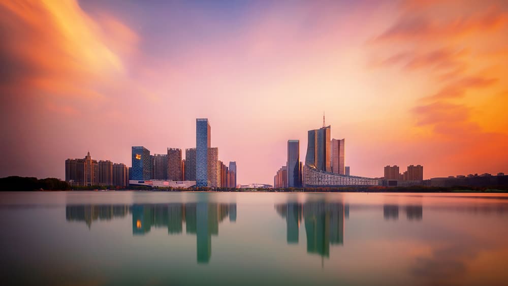 sunset over Swan Lake financial business district, Hefei city, China