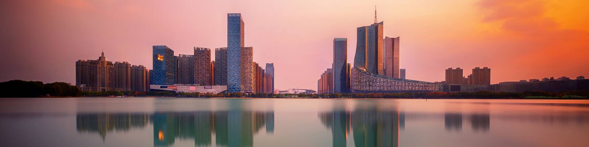 sunset over Swan Lake financial business district, Hefei city, China