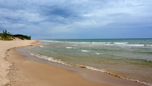 the picturesque beach next to the little sable point lighthouse in silver lake state park on lake michigan, in mears, michigan