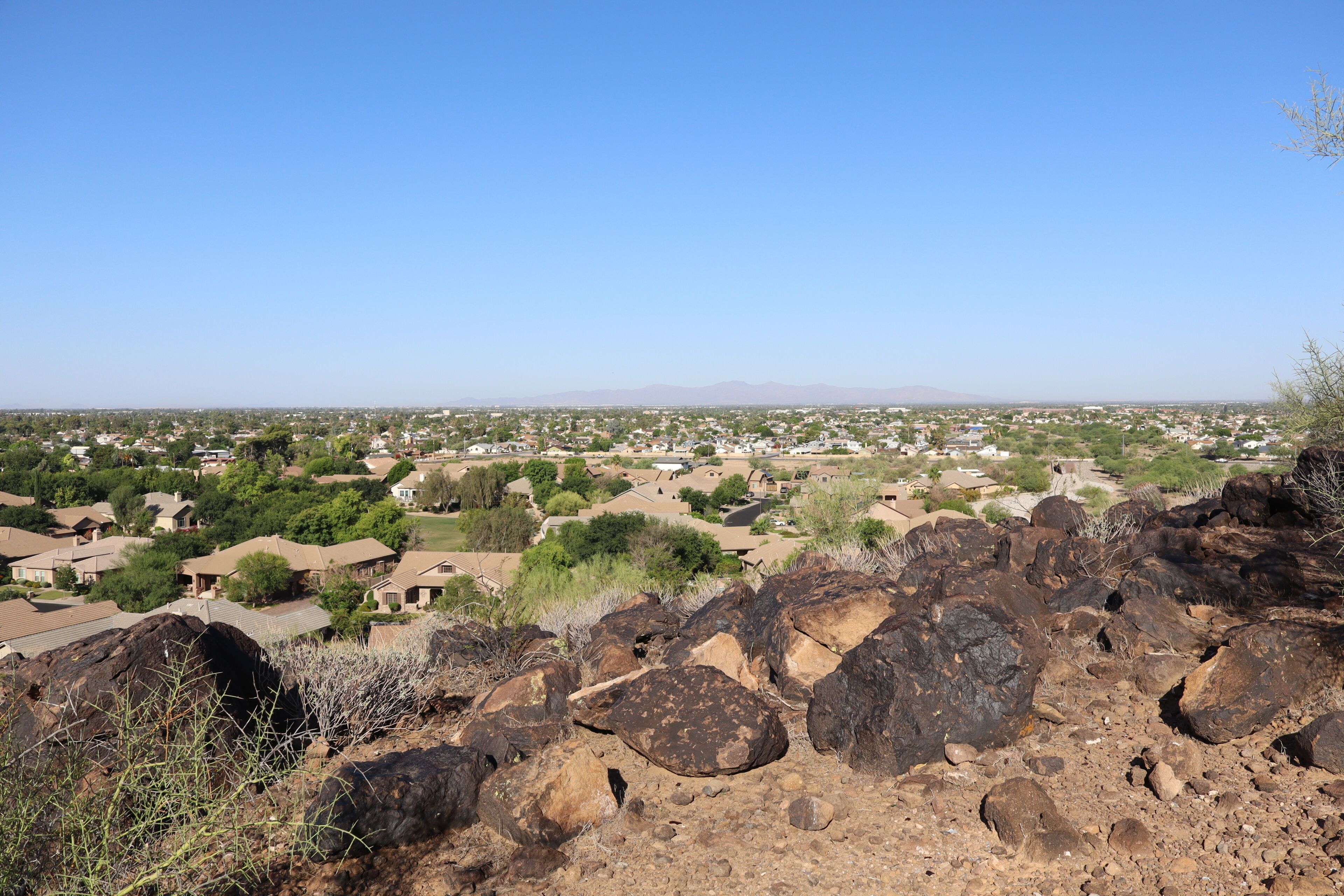Distant view of Phoenix, Glendale and Peoria also known as Valley of the Sun, from the top of Vision Hills, Arizona