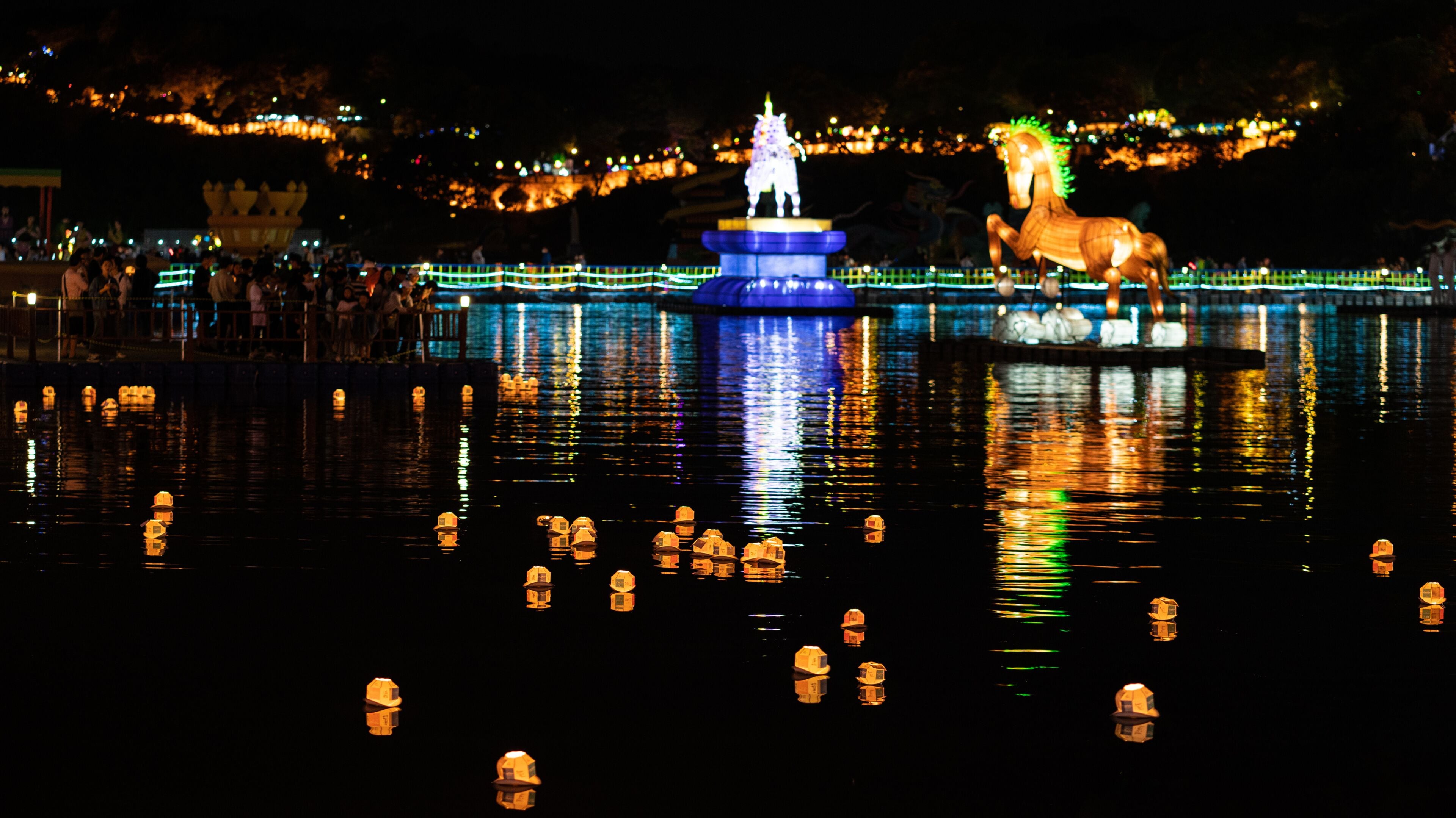 Jinju Namgang Yudeung or lanterns festival with traditional lanterns illuminated at night floating on Nam river Jinju South Korea