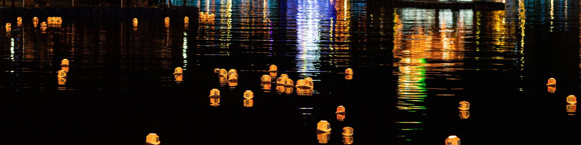 Jinju Namgang Yudeung or lanterns festival with traditional lanterns illuminated at night floating on Nam river Jinju South Korea