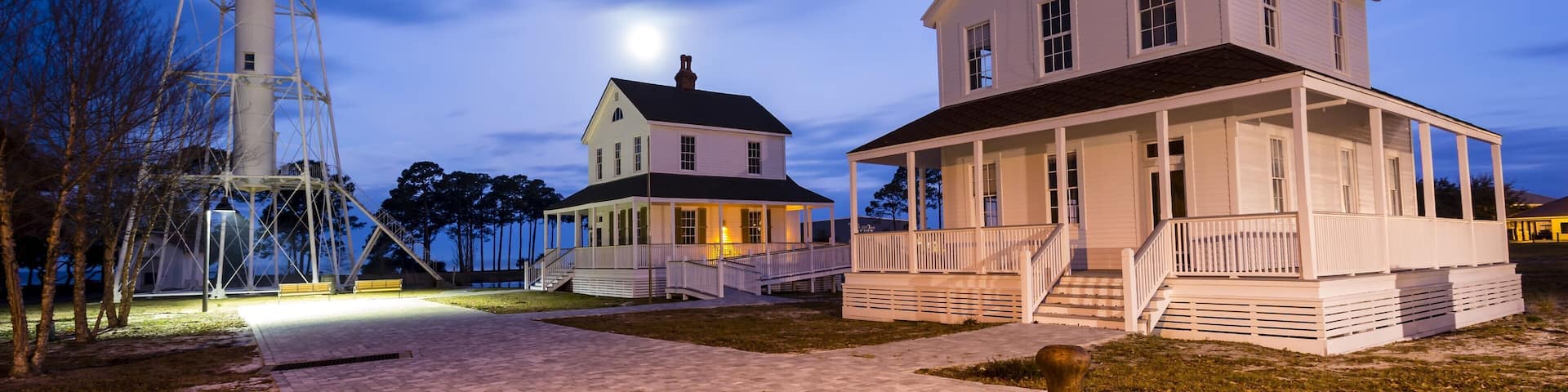 Beautiful old lighthouse being lit by a full moon just before dawn #BVSBLUE