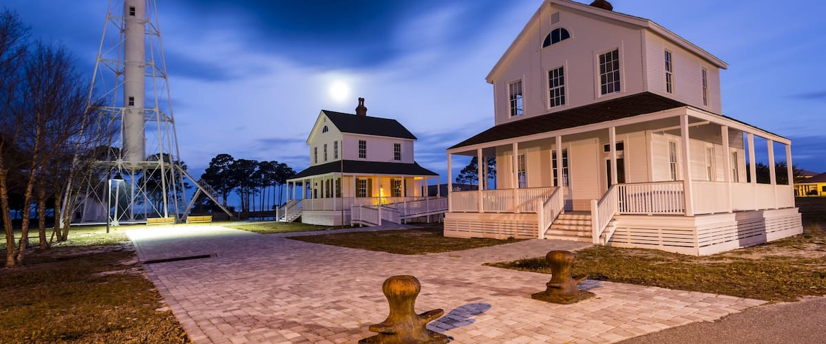 Beautiful old lighthouse being lit by a full moon just before dawn #BVSBLUE