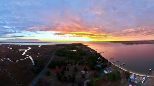 Aerial view of Princess Anne, Maryland with marshlands and waterways at sunset