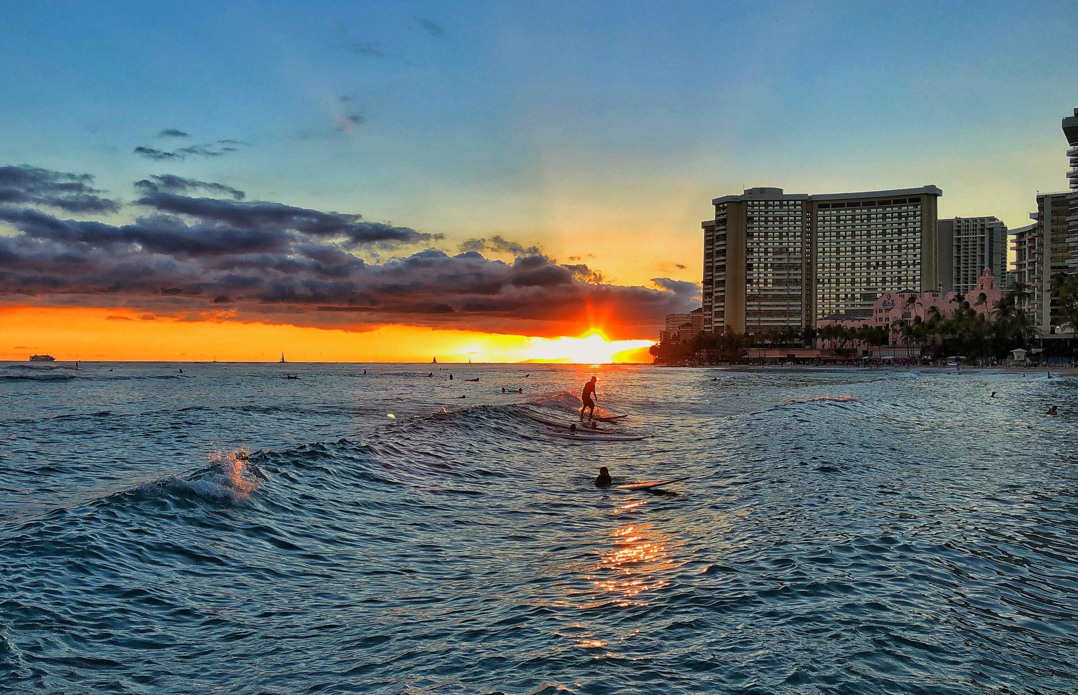 Sunset drone photo of a surfer.