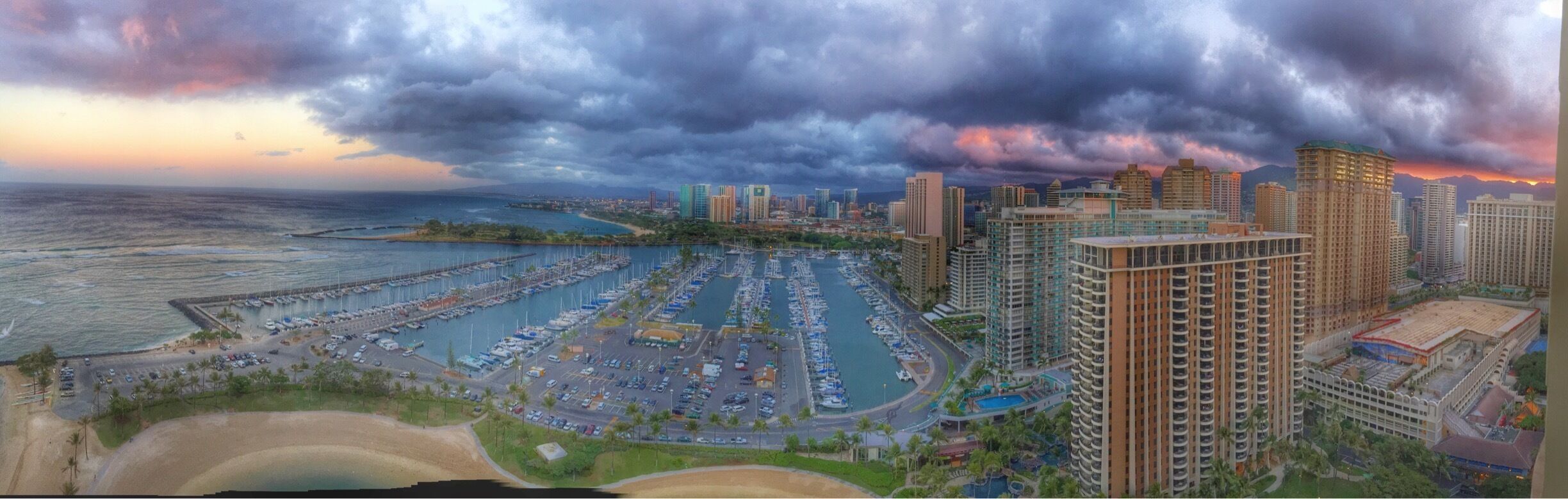 Oahu at sunrise as viewed from room 2900 in the Rainbow Tower at the Hilton Hawaiian Village Resort. The views from this hotel are magnificent and the resort is located right on Waikiki Beach.  

Those adverse to crowds and a lot of tourist development might want to consider another destination. We were married on the island and the resort was perfectly located for everything we needed and wanted to do. We did, however, follow up with 4 days of R&R on Kauai.

#BestOf5