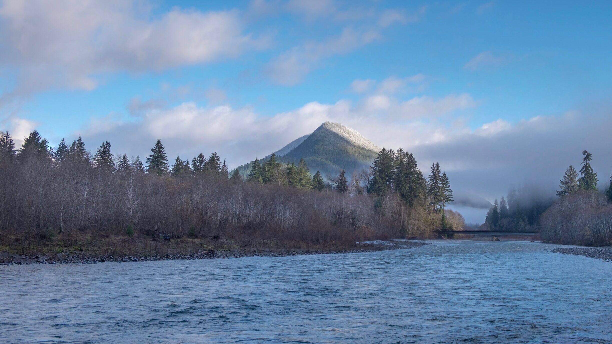 The is the North Fork of the Quinault River just a few miles above where it feeds into Lake Quinault. There's a 25 mile loop around the lake and a bridge about 11 miles north of the Quinault Lodge where you can cross the river. Wild life, old growth timber, and mossy rain forest. Beautiful everywhere you look.