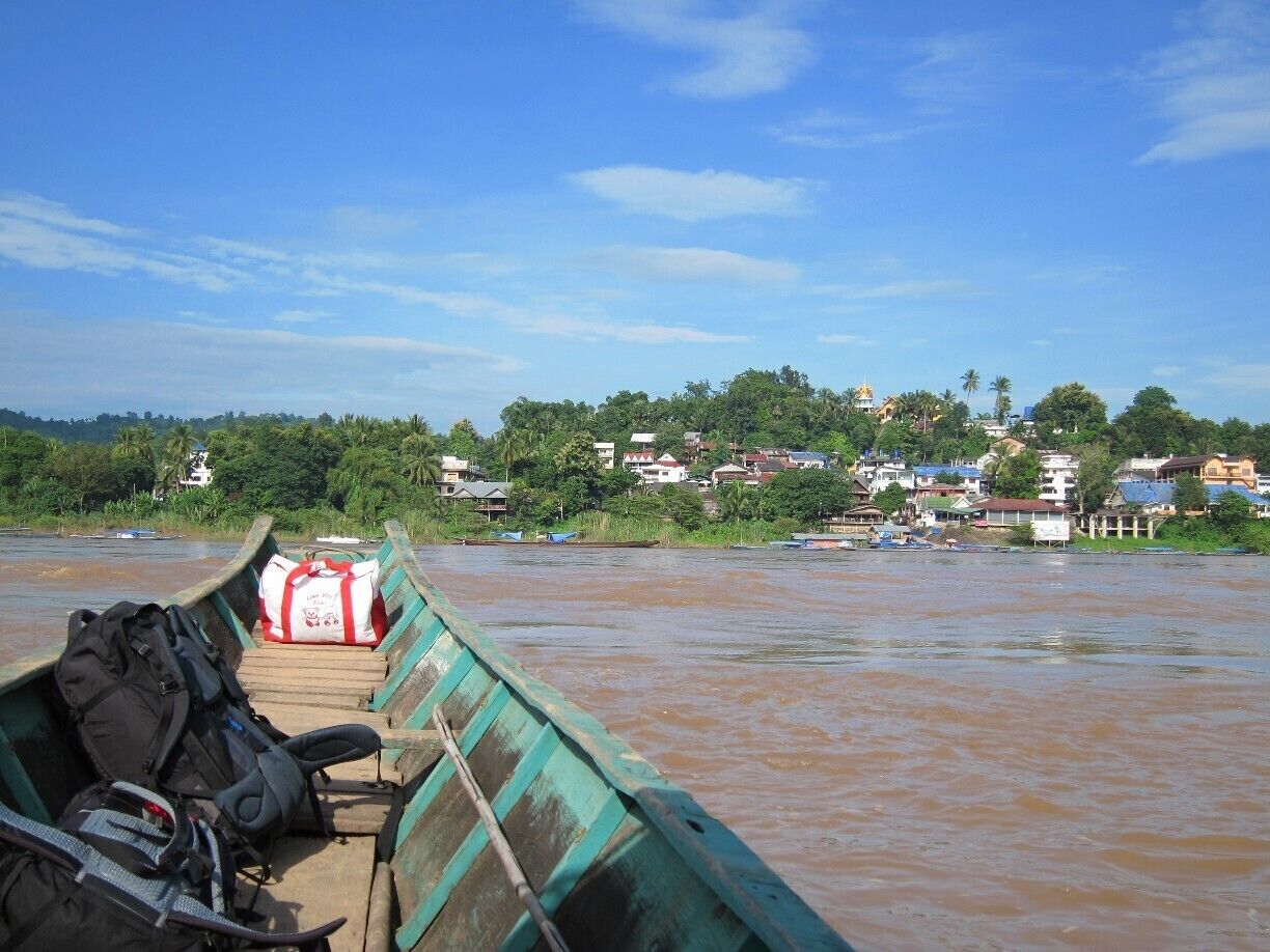 Leaving Thailand for Laos via the crossing not far from Chiang Rai you take a quick boat ride across the Mekong River and you will find yourself in Hauy Xai.  

Probably the largest draw for visiting this town is the Gibbon Experience in Bokeo NP a couple hours away.  Sleep in a tree house (if the insanely loud insects don't keep you awake) and do some outstanding ziplining all while helping support conservation efforts in the area and the local villages.  More details---> http://turtlestravel.com/doing-lines-and-flying-high/