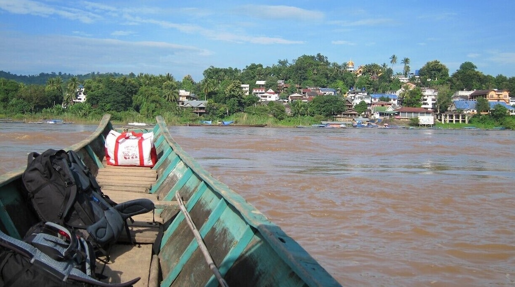 Leaving Thailand for Laos via the crossing not far from Chiang Rai you take a quick boat ride across the Mekong River and you will find yourself in Hauy Xai.
Probably the largest draw for visiting this town is the Gibbon Experience in Bokeo NP a couple hours away. Sleep in a tree house (if the insanely loud insects don't keep you awake) and do some outstanding ziplining all while helping support conservation efforts in the area and the local villages. More details---> http://turtlestravel.com/doing-lines-and-flying-high/