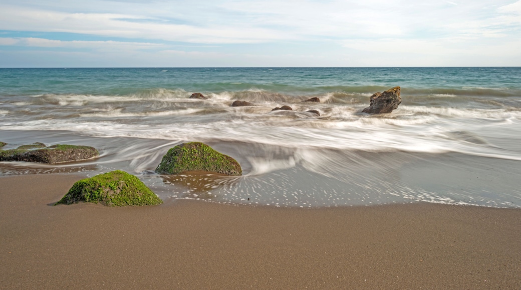 Waves on a rocky beach in slow motion